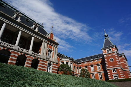 Red Brick Building and cirrus clouds in the autumn sky