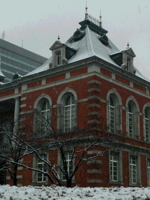 Red Brick Building and cherry trees waiting for spring to come